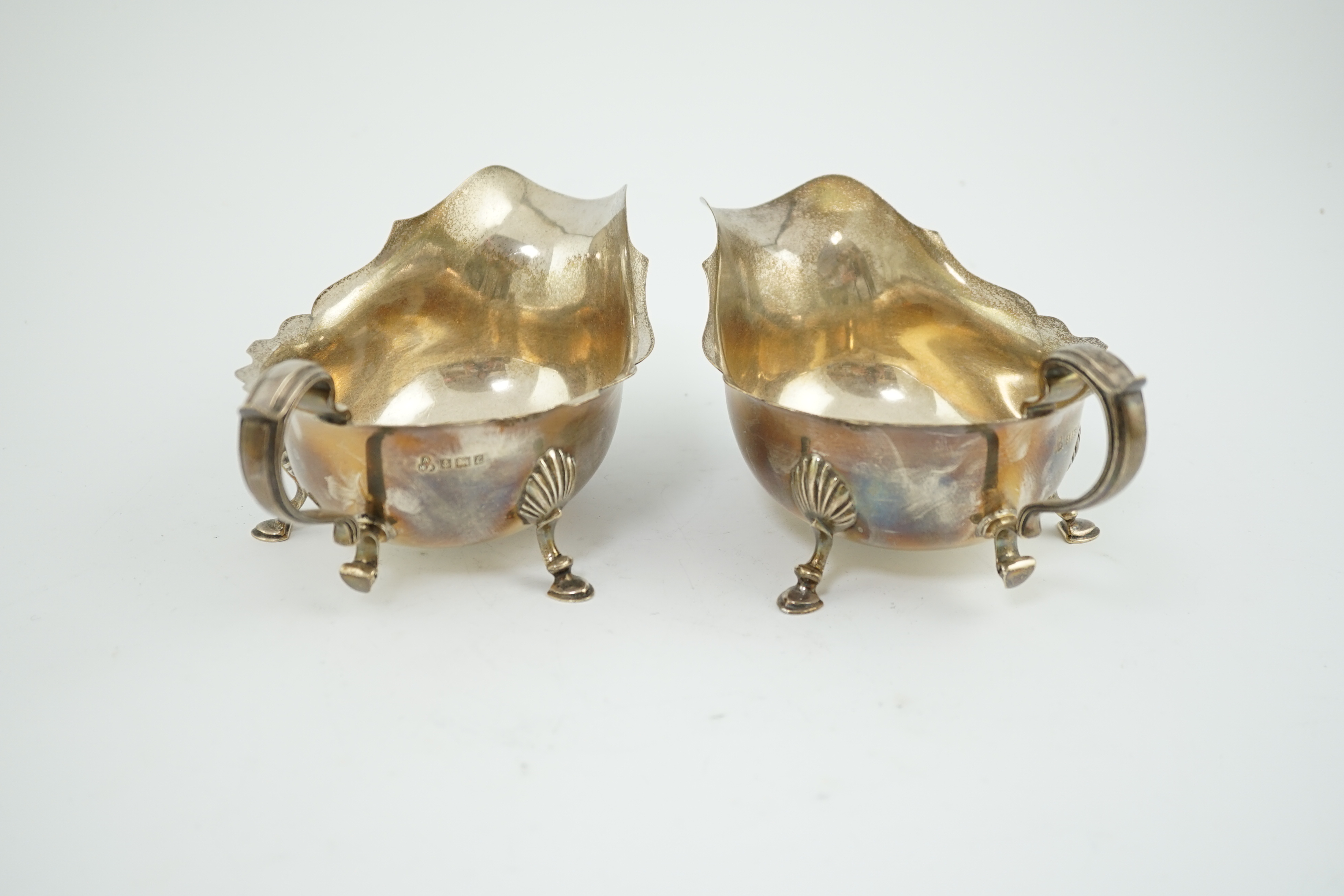 A pair of Elizabeth II silver sauce boats, maker A over HA